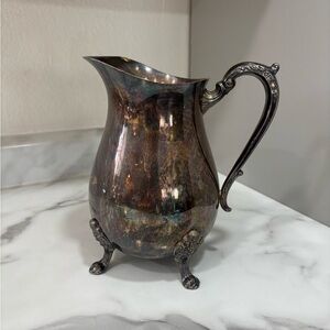 Ornate Silver Footed Pitcher